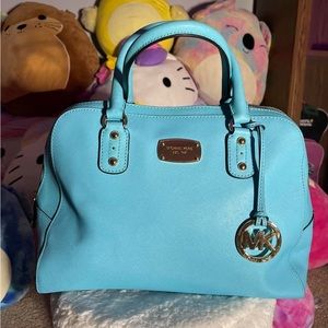 michael kors purse in a turquoise or cyan like blue, relatively large